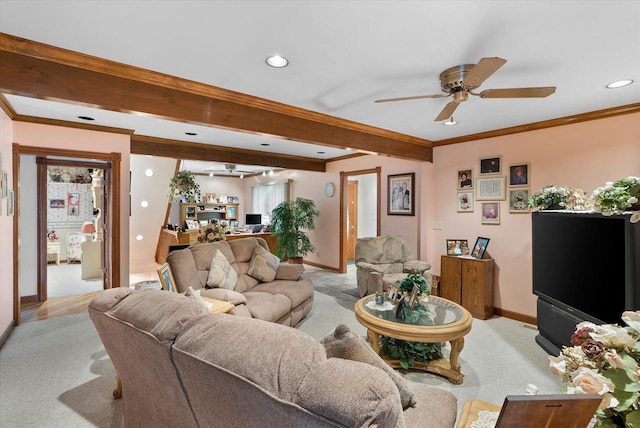 living room featuring ornamental molding, light colored carpet, ceiling fan, and beamed ceiling