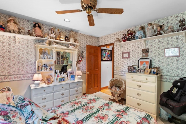 bedroom with ceiling fan and light hardwood / wood-style flooring