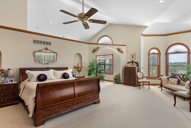 bedroom featuring ceiling fan, light colored carpet, high vaulted ceiling, and multiple windows