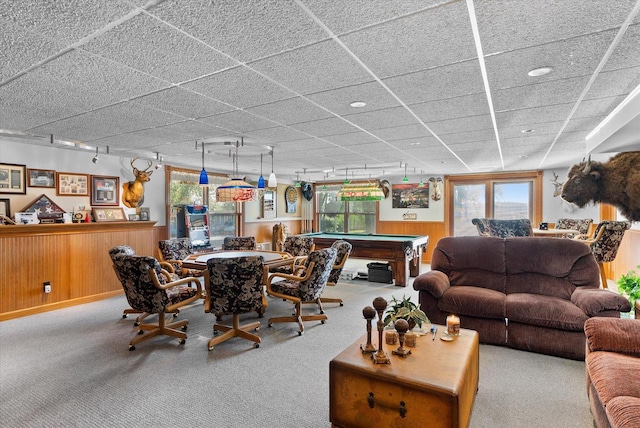 carpeted dining room with billiards, a paneled ceiling, and rail lighting