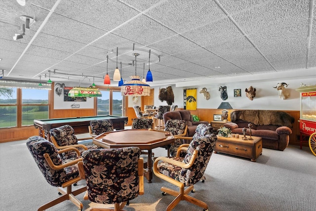 carpeted dining area featuring pool table