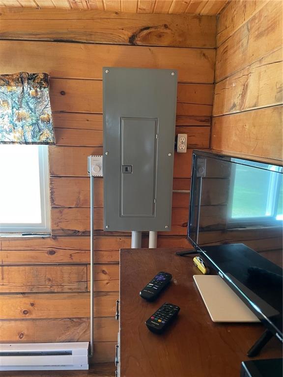 N2141 Pondell Ln, Bruce, WI 54819 - utility room with baseboard heating