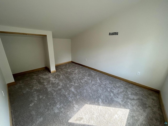 unfurnished bedroom with carpet and a closet