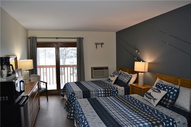 bedroom featuring dark hardwood / wood-style floors and a wall mounted AC