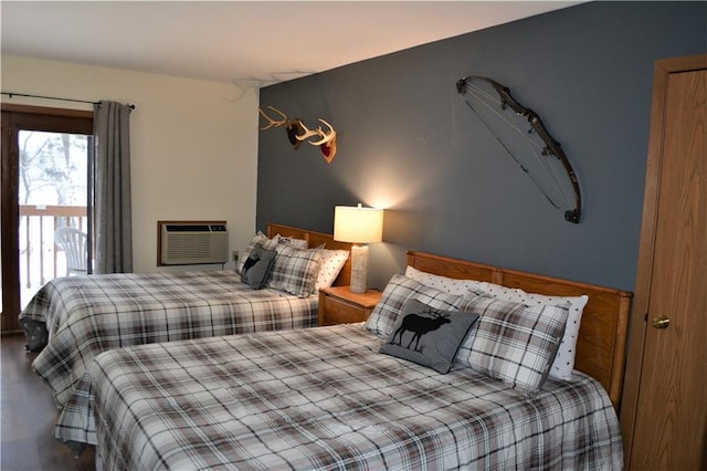 bedroom featuring an AC wall unit