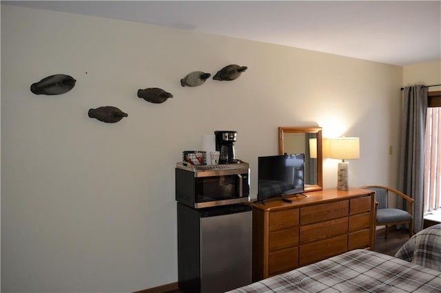 bedroom featuring wood-type flooring