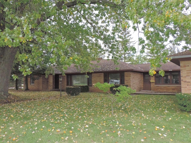 ranch-style house with a front lawn