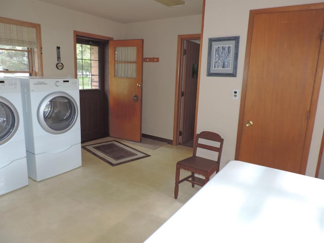 clothes washing area featuring washing machine and dryer