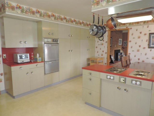 kitchen with stovetop and double wall oven