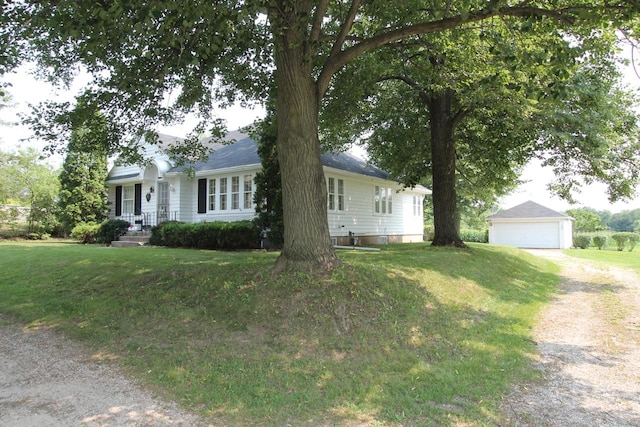 ranch-style house featuring a front lawn and a garage