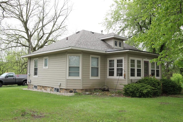 back of house with a yard