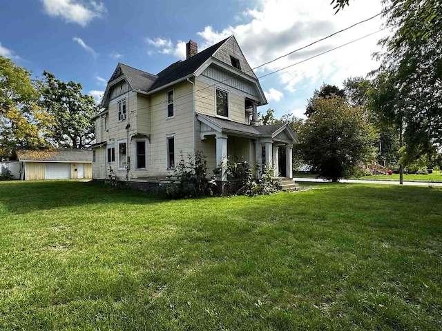 rear view of house with a yard