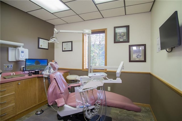 home office with a paneled ceiling