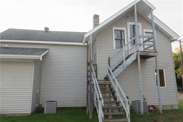 back of property featuring central air condition unit