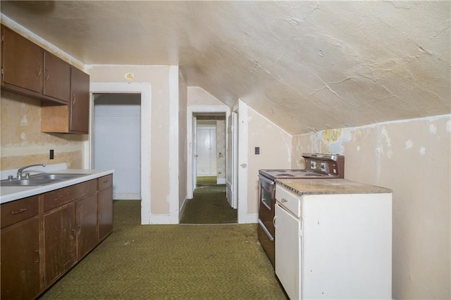 kitchen with range with electric cooktop, dark brown cabinets, lofted ceiling, dark colored carpet, and sink