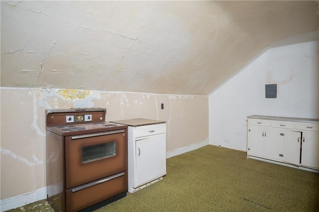 kitchen with white cabinets, lofted ceiling, electric stove, and light carpet