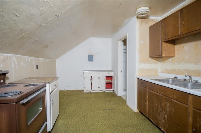 kitchen featuring lofted ceiling, electric stove, dark carpet, and sink