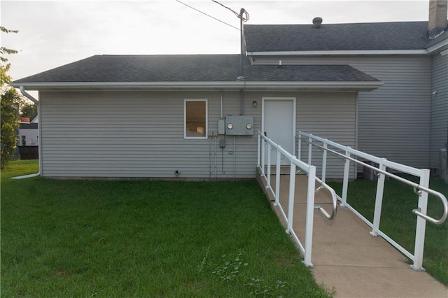 rear view of house with a yard