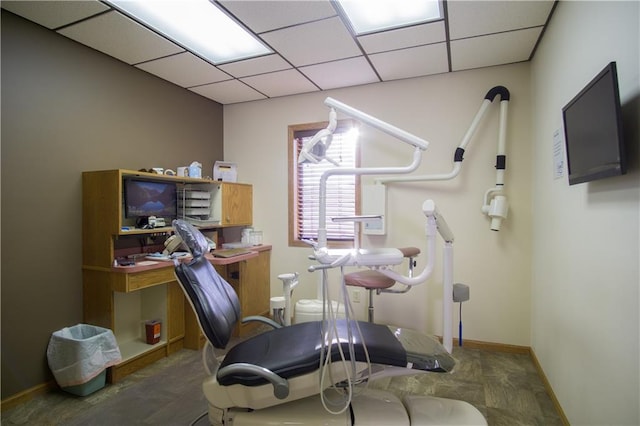 exercise room with a drop ceiling