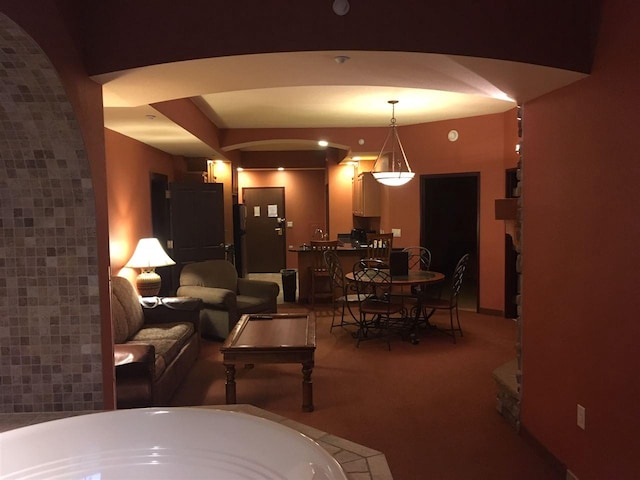 living room featuring dark colored carpet