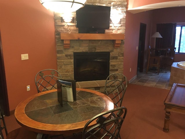 interior space with a stone fireplace