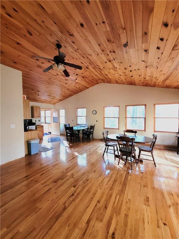 dining area featuring ceiling fan, wood ceiling, vaulted ceiling, and light wood-type flooring