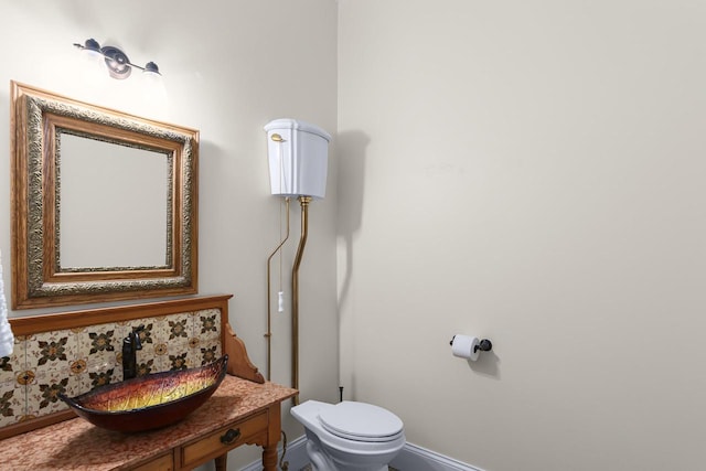 bathroom with toilet and vanity