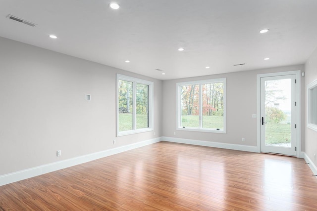 unfurnished room featuring light wood-type flooring