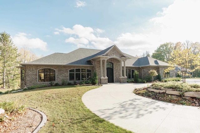 single story home featuring a front yard