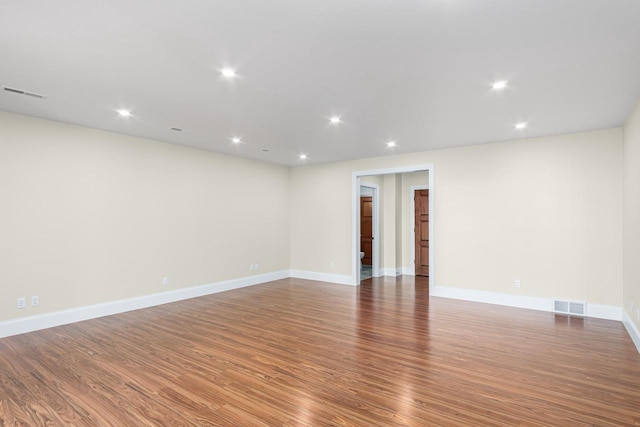 unfurnished room featuring hardwood / wood-style flooring