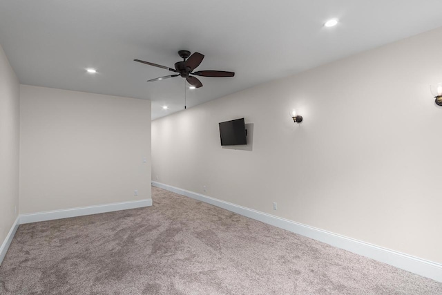 carpeted empty room featuring ceiling fan