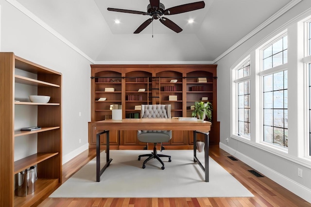 office space with light hardwood / wood-style flooring, ceiling fan, lofted ceiling, and a healthy amount of sunlight