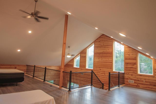 bonus room featuring ceiling fan, dark wood-type flooring, and vaulted ceiling