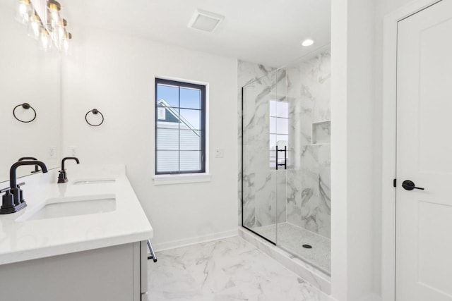 bathroom featuring a marble finish shower, marble finish floor, baseboards, and a sink