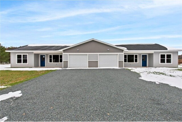 single story home featuring a garage