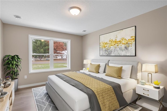 bedroom with wood-type flooring