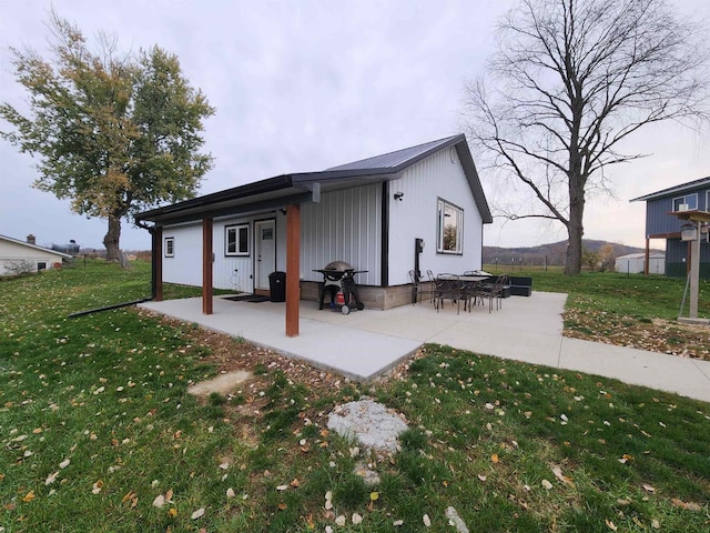 exterior space with a patio and a yard