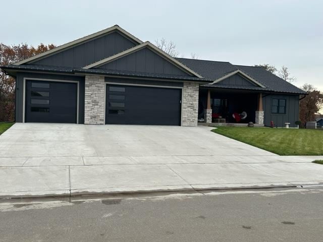 view of front facade with a front lawn and a garage