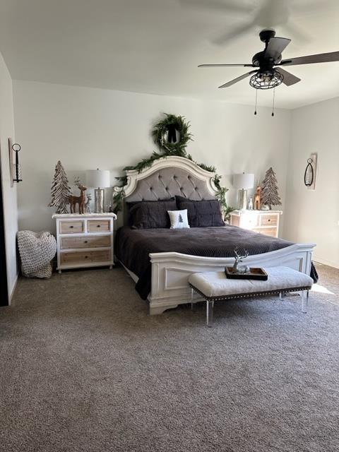 carpeted bedroom with ceiling fan