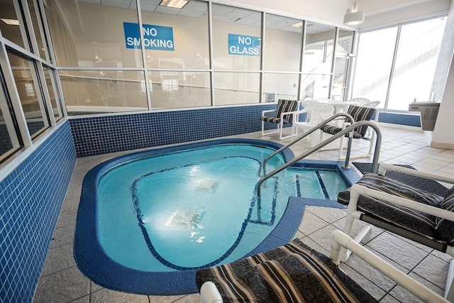 view of pool with an indoor hot tub