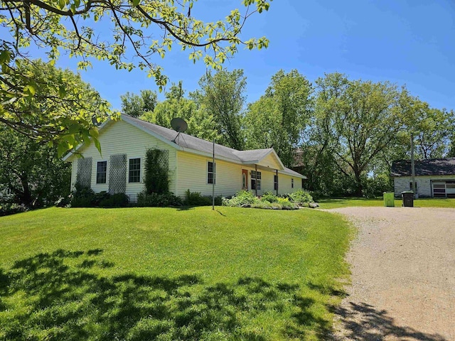 view of property exterior featuring a yard