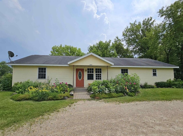 ranch-style house with a front lawn