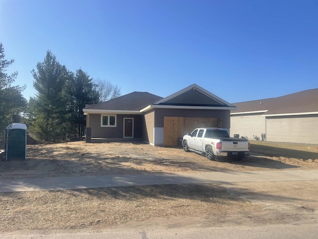 single story home featuring a garage