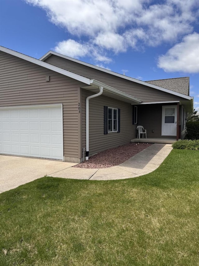 exterior space featuring a yard and a garage