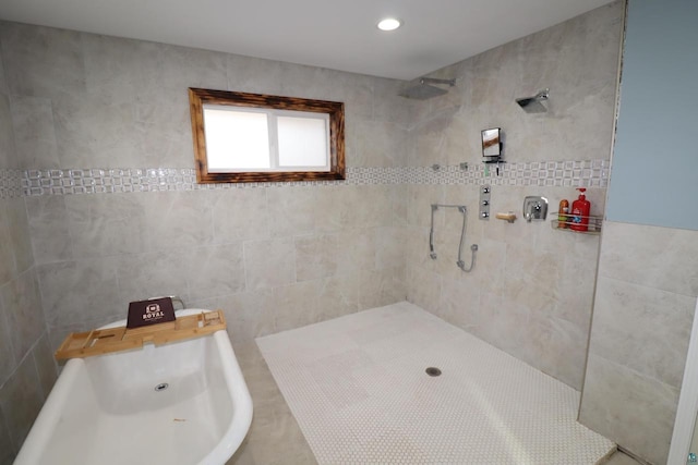 bathroom with tile walls and tiled shower