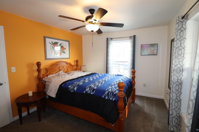 bedroom with ceiling fan and dark colored carpet