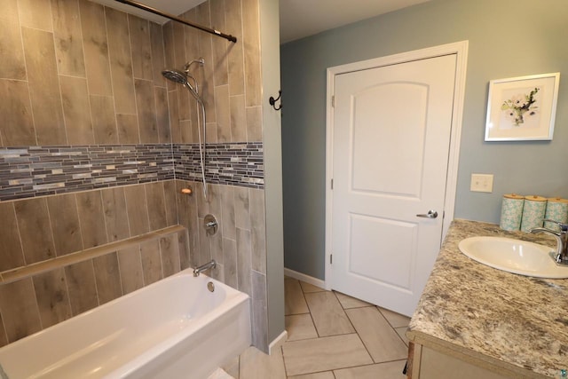 bathroom featuring tile floors, tiled shower / bath combo, and vanity