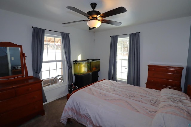 carpeted bedroom with ceiling fan