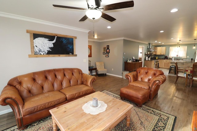 living room featuring ceiling fan, crown molding, and dark wood-type flooring