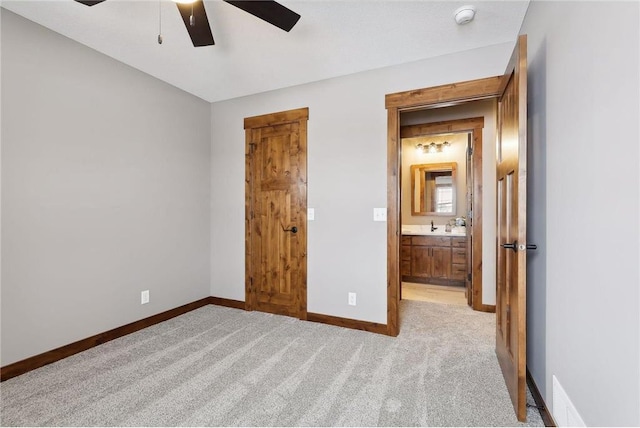 unfurnished bedroom with light carpet and ceiling fan